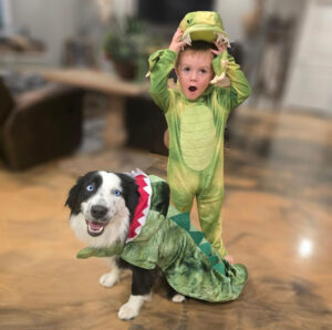 Kid and doggie with a costume on